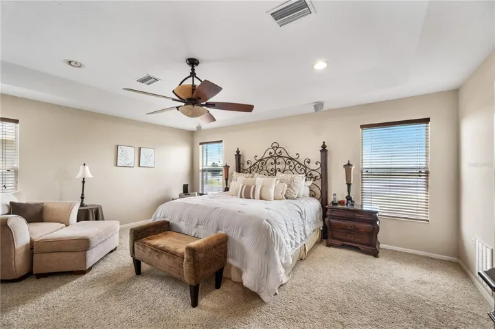 The Primary Suite is well appointed and has a spectacular view of Island Lake &amp; the 15 Hole .