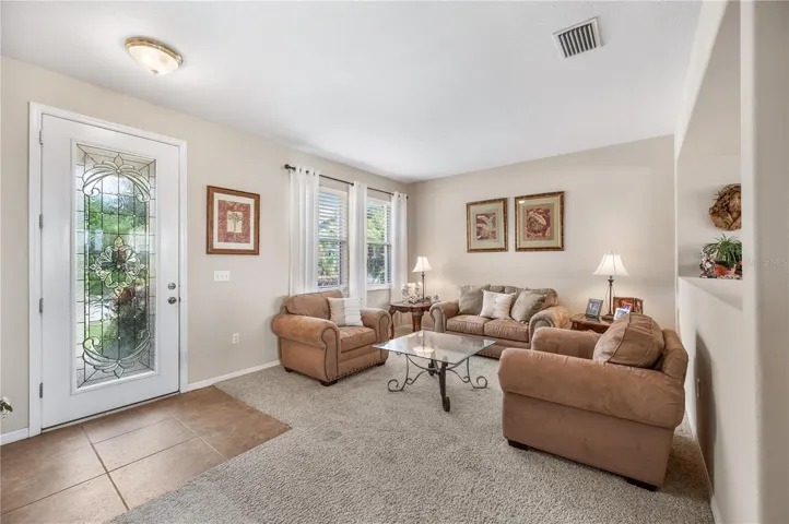 Flooded with natural light , one of the homes main social spaces is light &amp; bright!