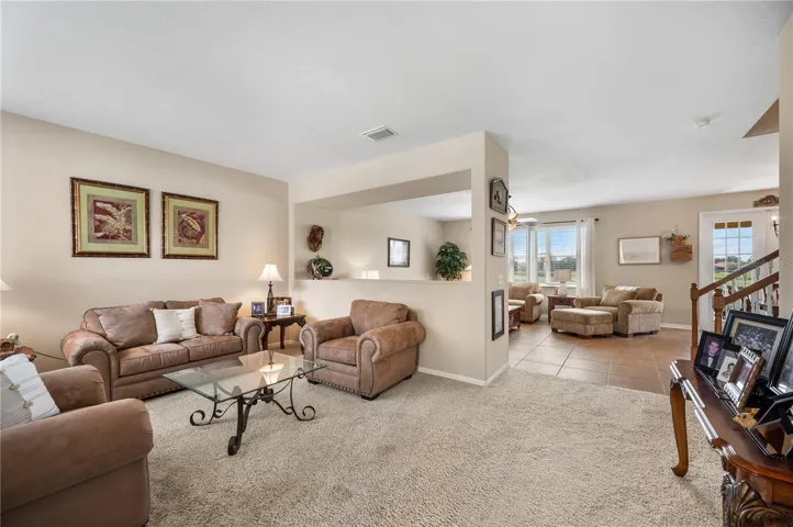 As you enter ,the view from the front to the rear of the home is spectacular. The Open floor plan lends itself to seamless entertaining and family fun.