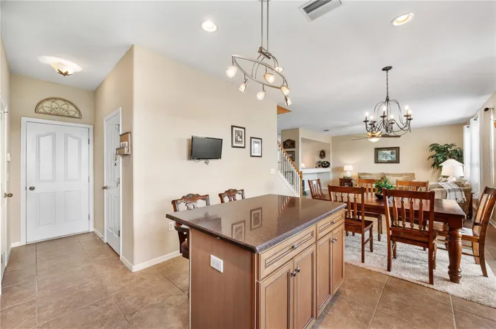 Right of f the kitchen is a well appointed half bathroom and exit to a large 2 car garage .