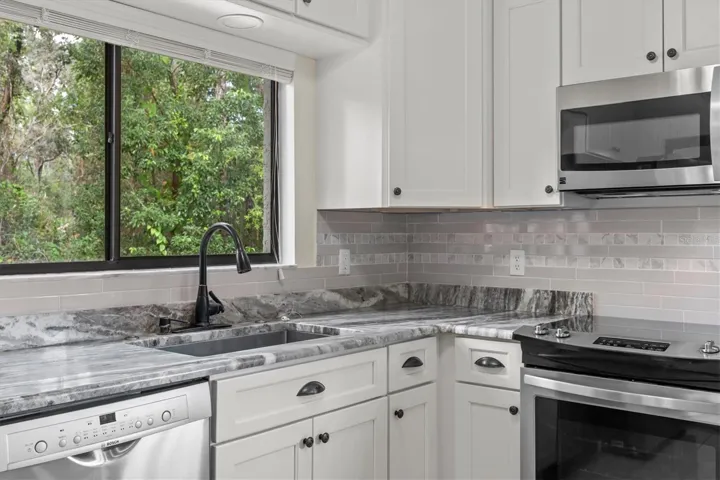White Shaker Soft Close Cabinets with Subway Tile Backsplash