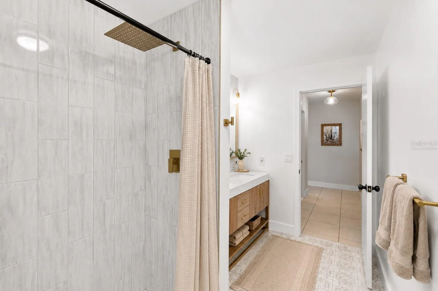 Custom tilework and oversized shower head -Virtually Staged