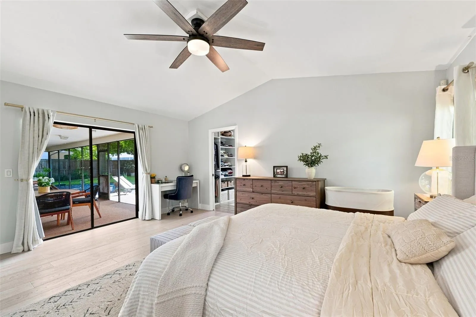Primary Suite with large glass sliding pocket doors out to screened in lanai
