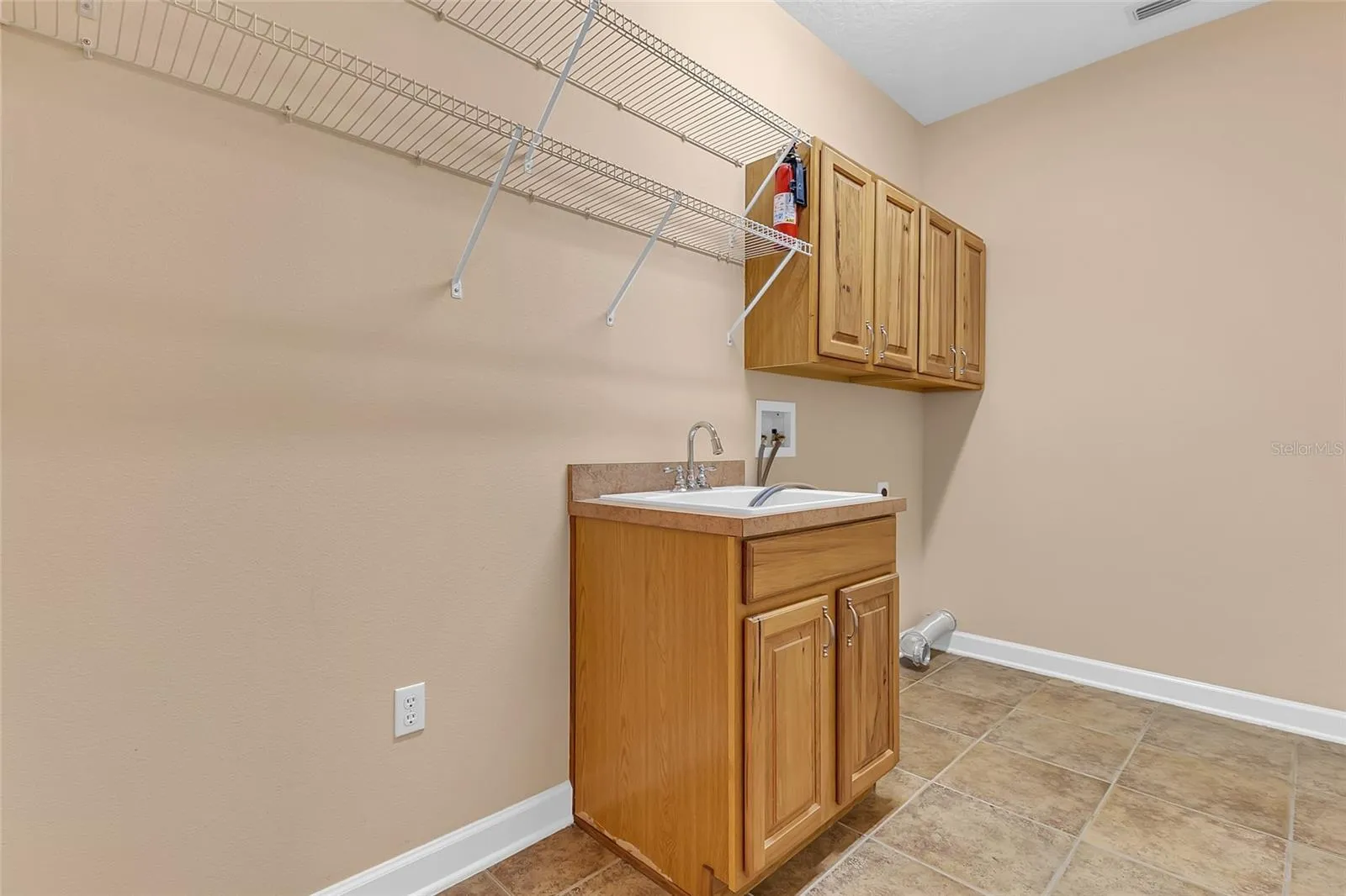 Large Laundry Room that leads to the 3 Car Garage