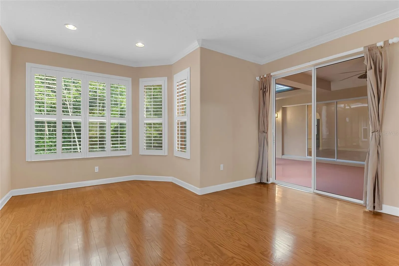 Primary Bedroom with Conservation View and Screened Lanai Access