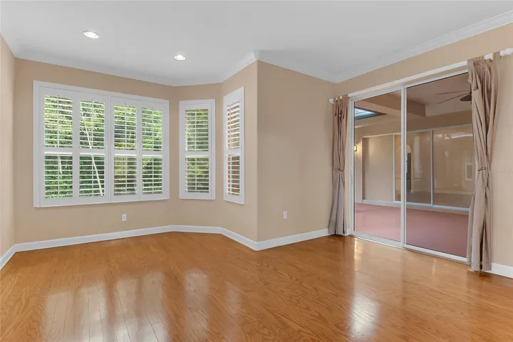 Primary Bedroom with Conservation View and Screened Lanai Access