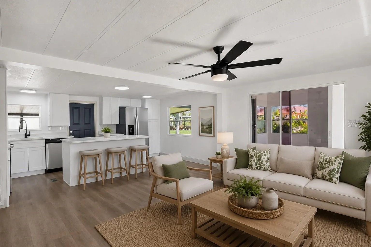 Virtually Staged. Living Room, with sliding door to Florida Room