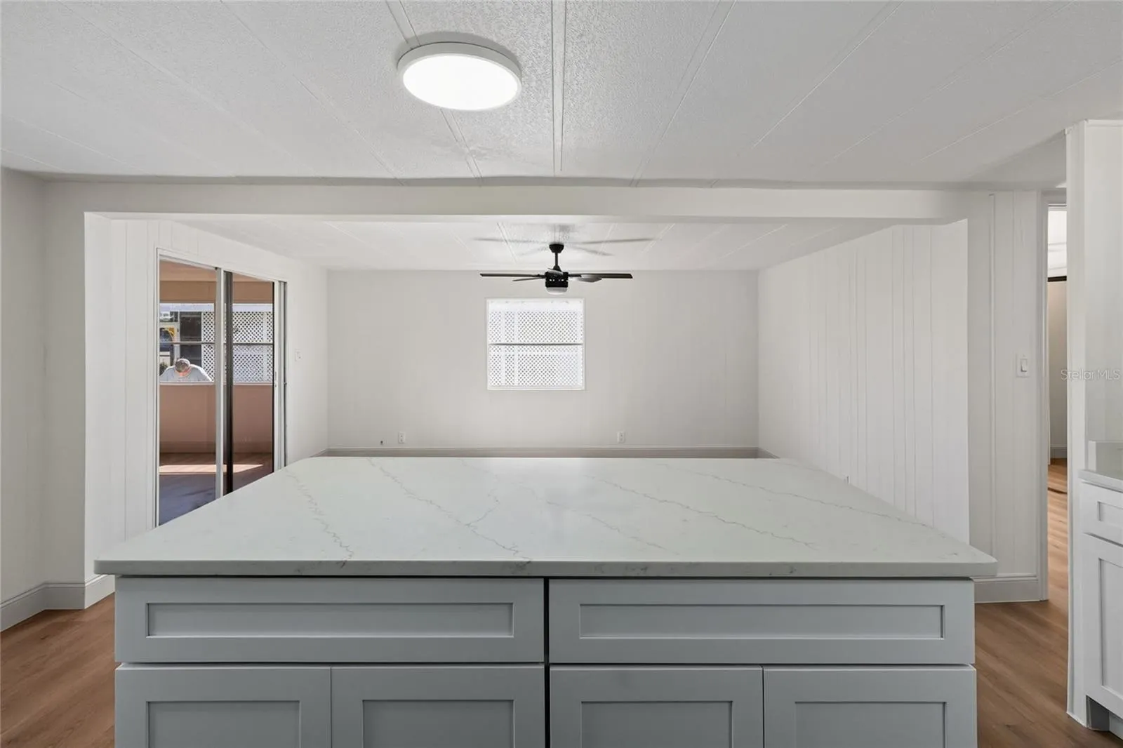 Large kitchen island with breakfast bar, solid surface counter tops