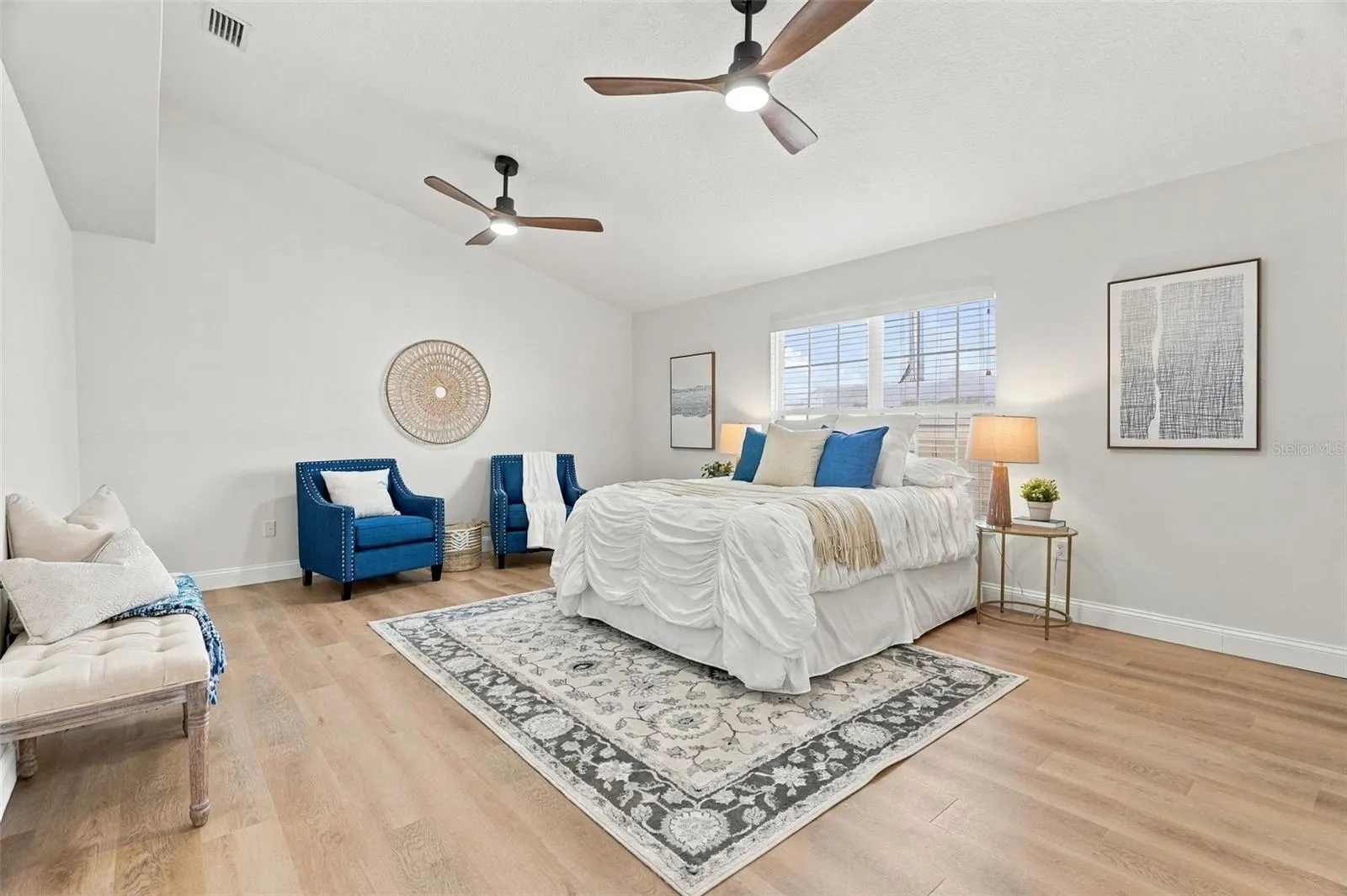 Spacious primary suite with vaulted ceilings.