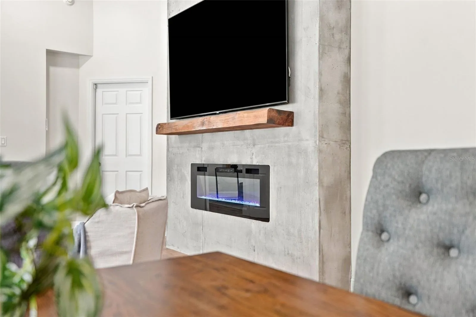 An electric fireplace creates a striking focal point.