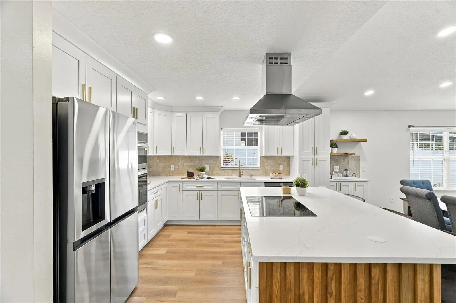 A generous center island with built-in outlets add ease for everyday living.
