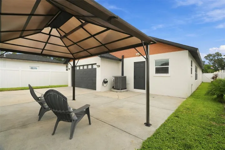 A fully fenced yard, pergola, and entertaining area create a perfect setting for grilling, dining, and relaxing.