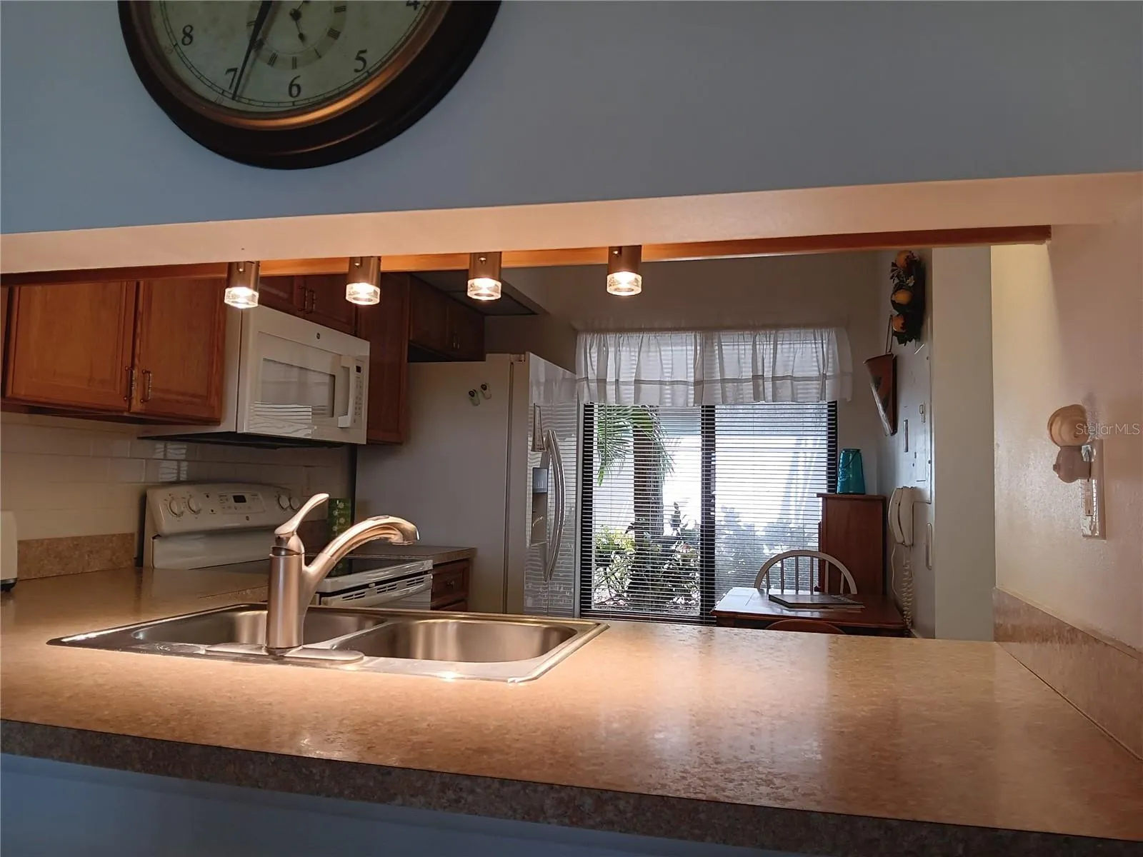 Kitchen pass through assures the cook has a great view!