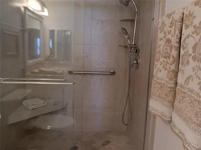 Primary shower offers a bench for your convenience.