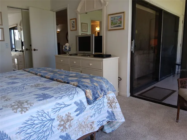 Sliding door access to screened lanai from Primary suite.
