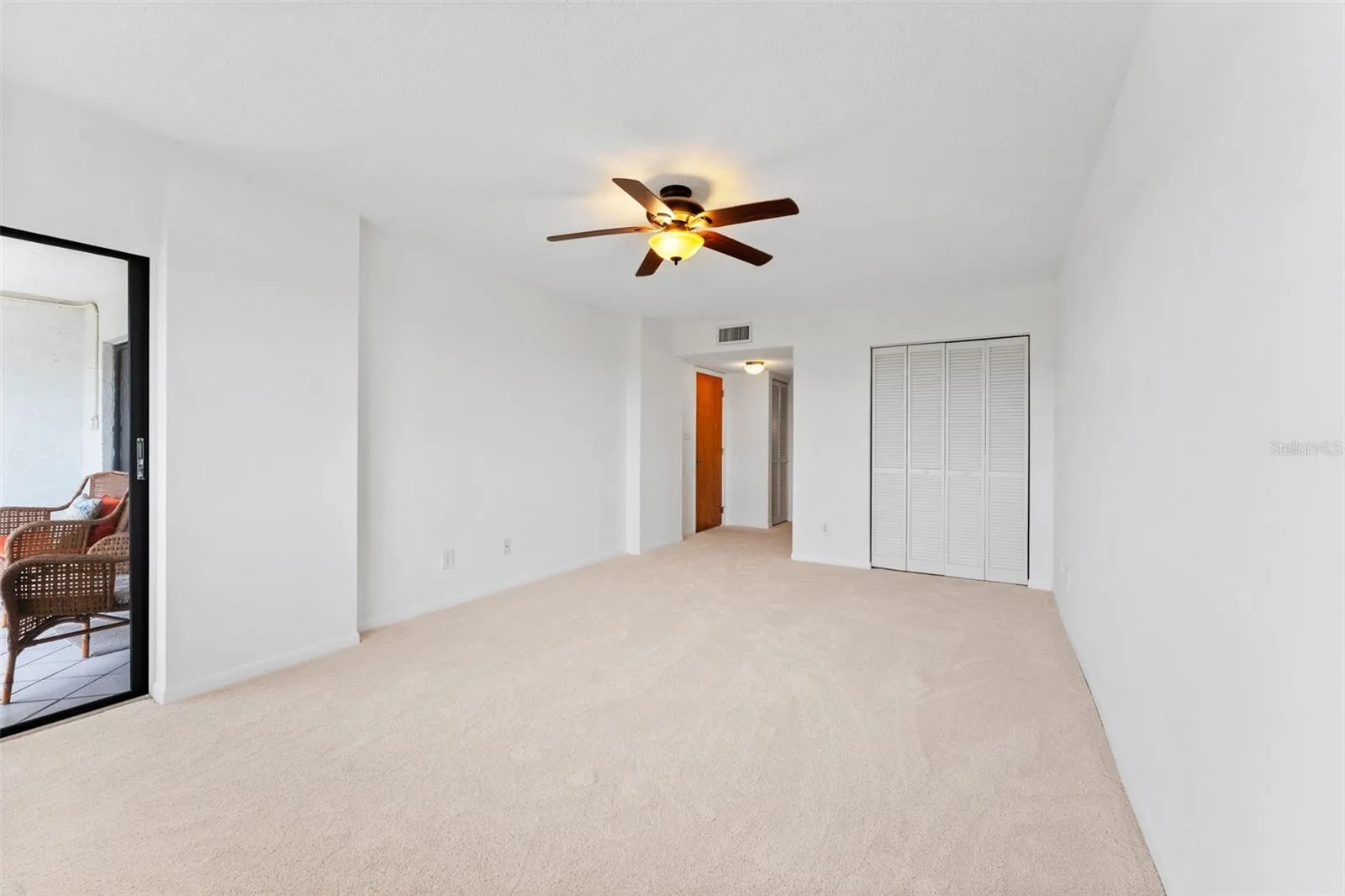 The primary bedroom is oversized, and has loads of closet space.  You also have access to your screened lanai from here.