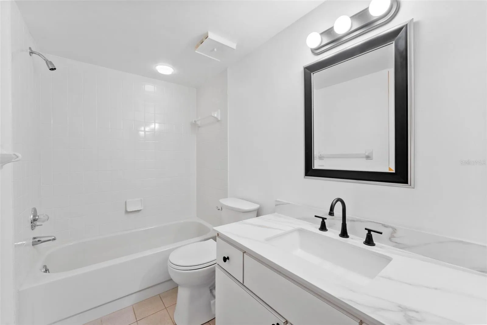 New vanity and toilet in the guest bathroom.