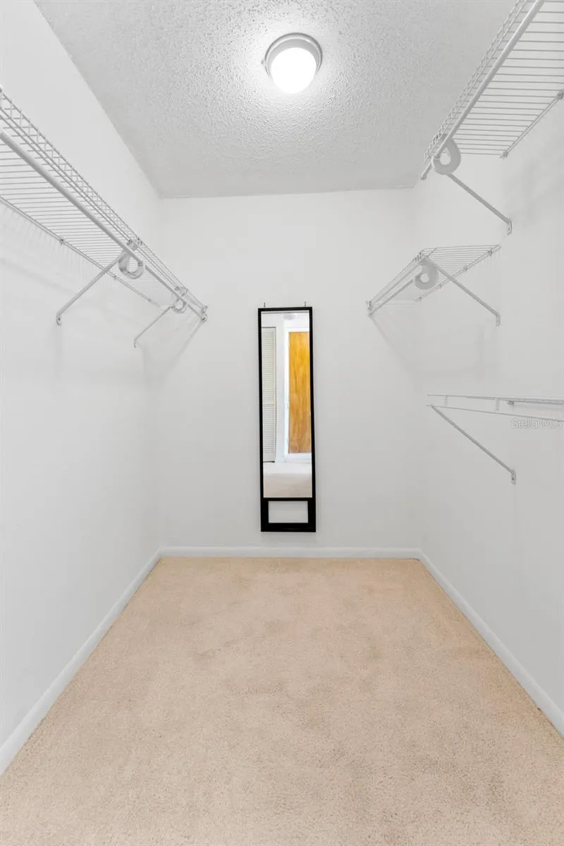 Large walk in closet in Primary bedroom, this is one of 3 closets in the Primary.