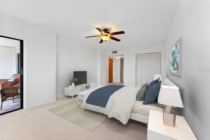 Virtually staged primary bedroom, there is room for a king sized bed as well as a sitting area here.  This room is generous!