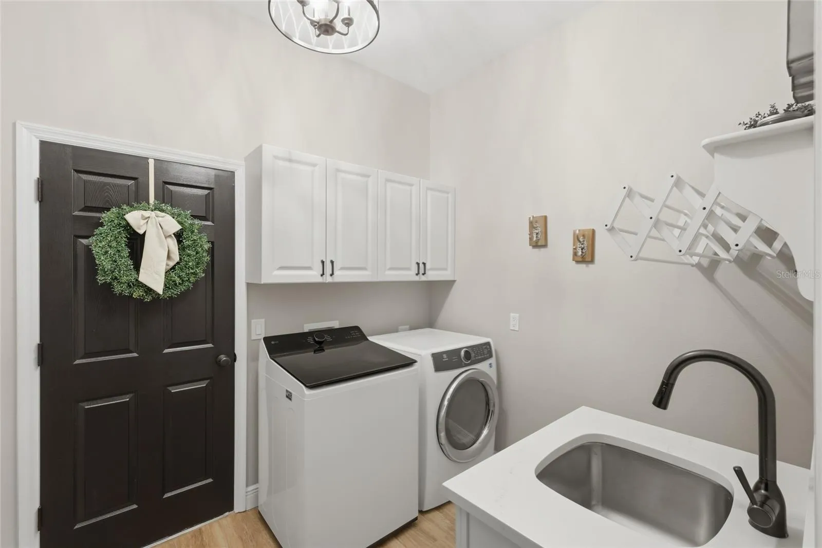 Laundry room is adjacent to primary suite.