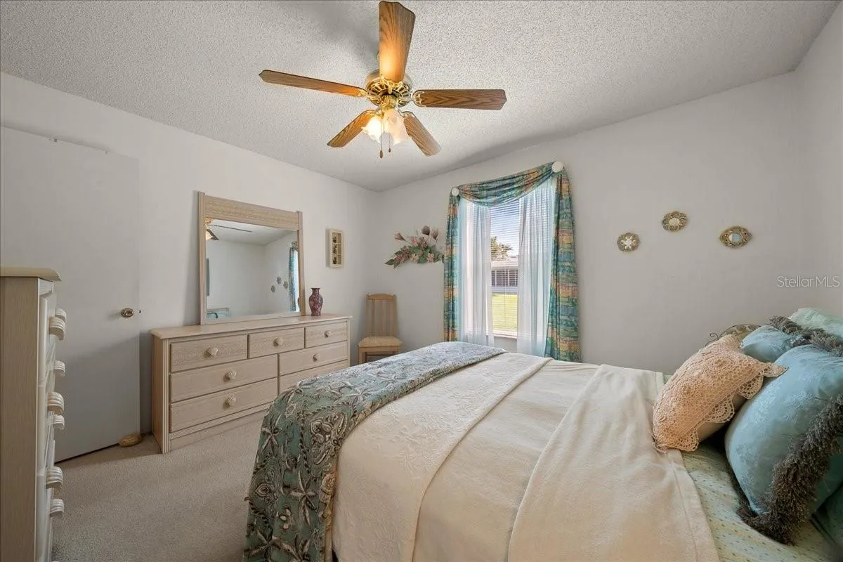 Guest Bedroom Features Ceiling Fan &amp; Built-in Closet