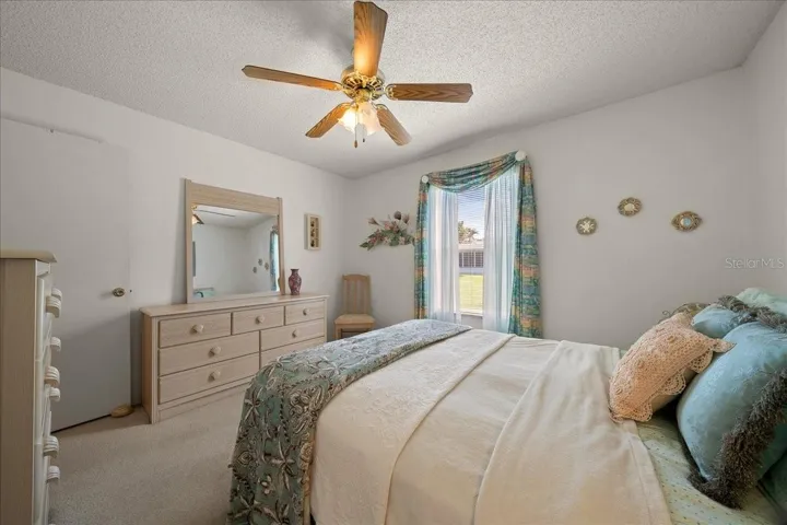 Guest Bedroom Features Ceiling Fan &amp; Built-in Closet