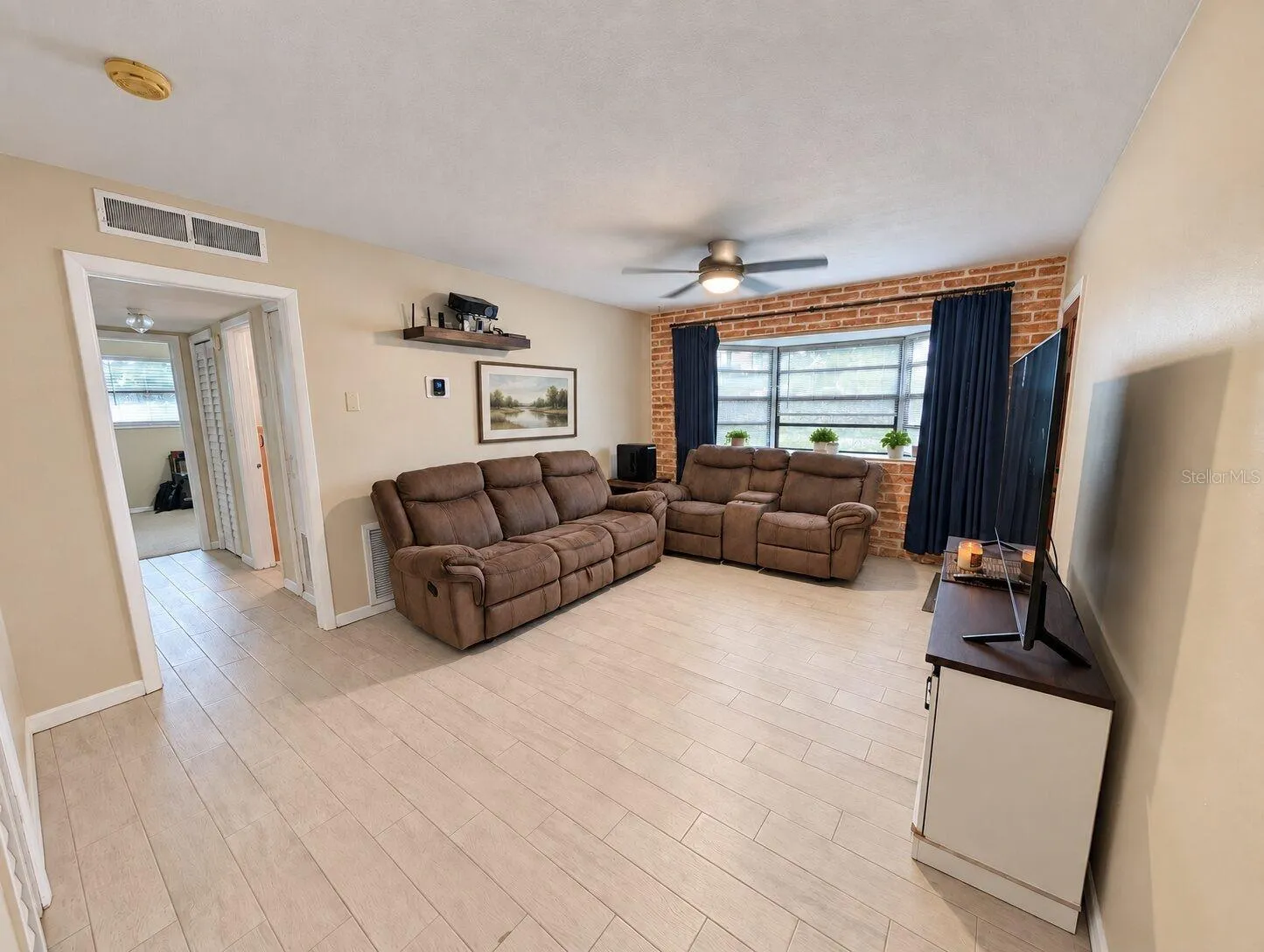 Hall way to two bedrooms and the bathroom