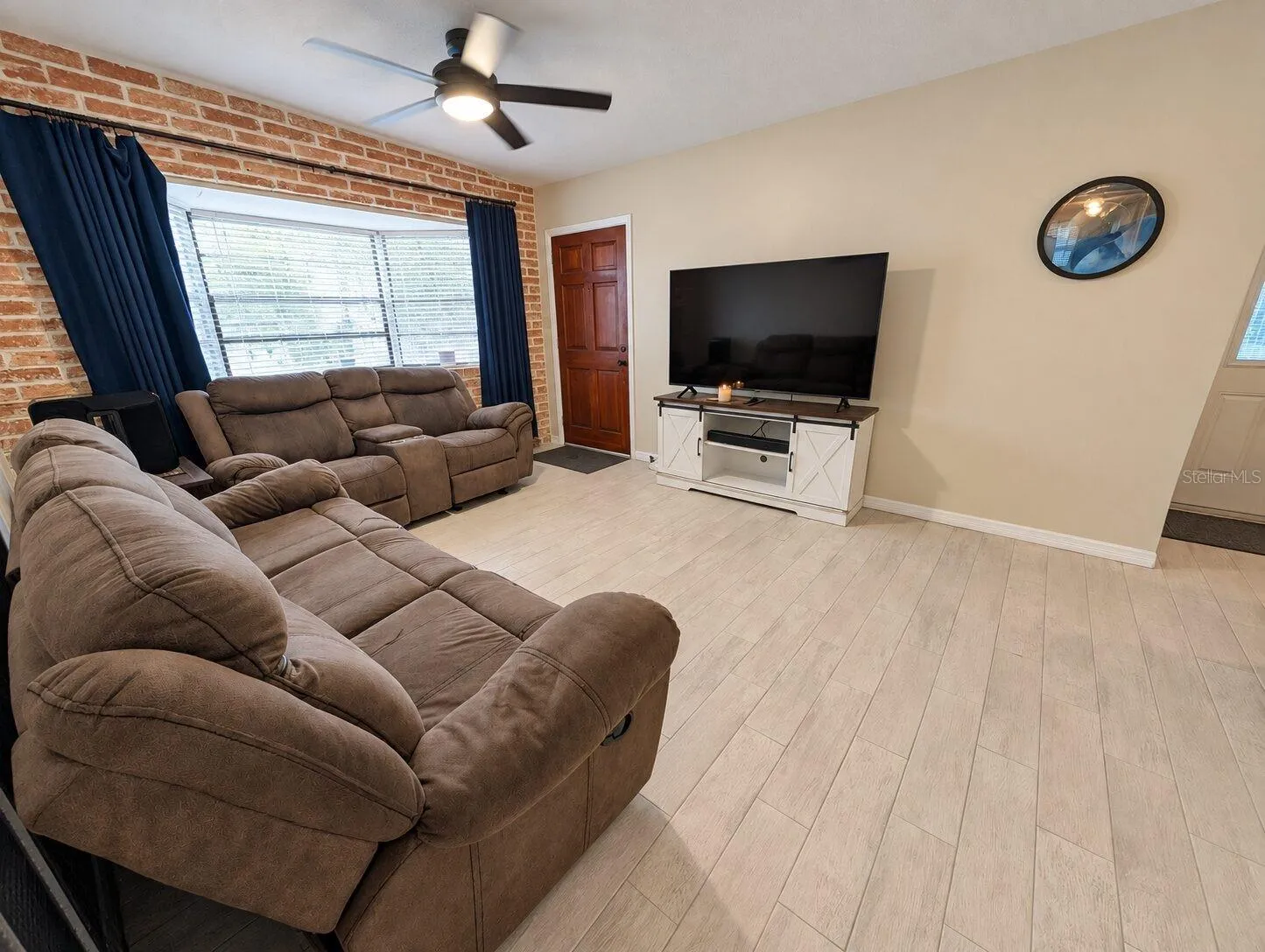 Accent wall and plenty of room for an entertainment center.