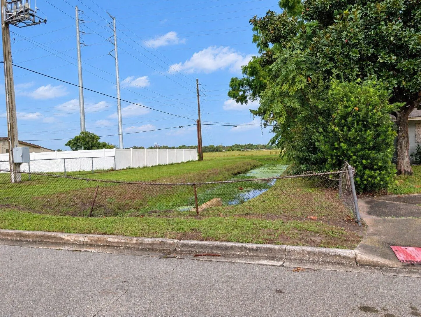 No rear neighbor to the right side and oddly this area is included in the survey, but maintained by the county.