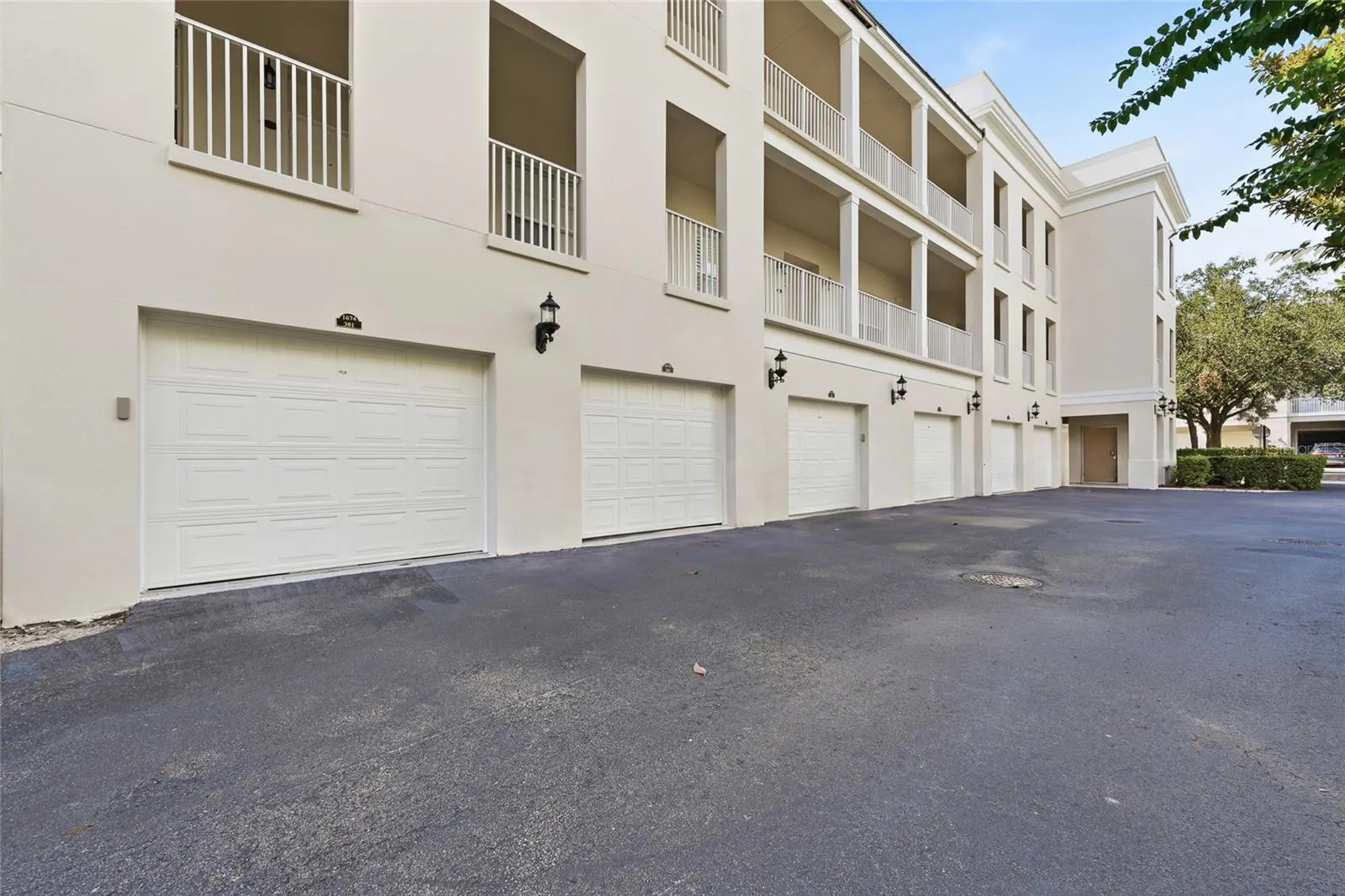 Rear view of the residence and private garage access.