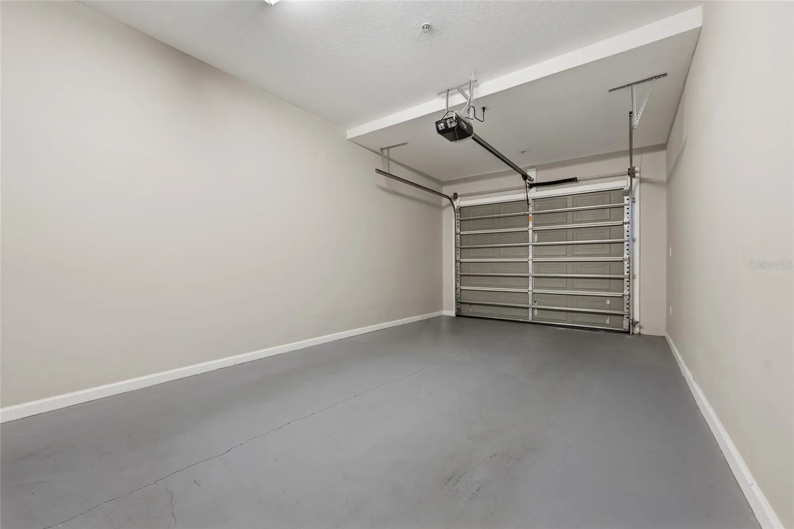 Private attached one-car garage provides secure parking and additional storage.