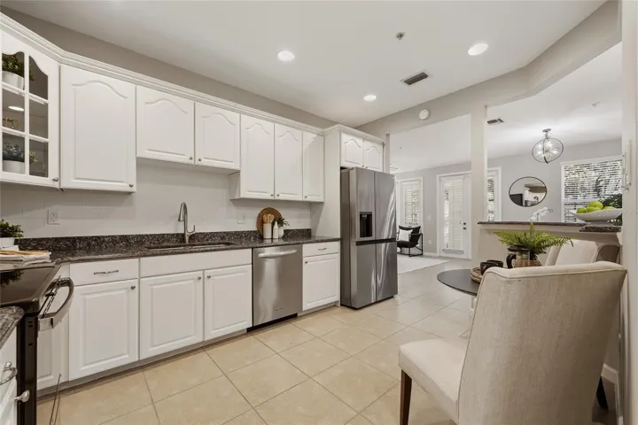 Kitchen flows seamlessly into the living space, highlighting the open layout and easy connection between rooms.