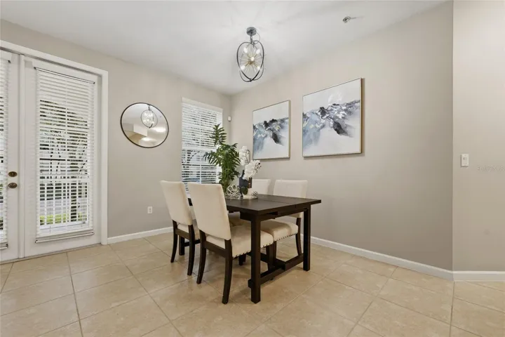 Dedicated dining area with abundant natural light and direct access to the covered outdoor space.