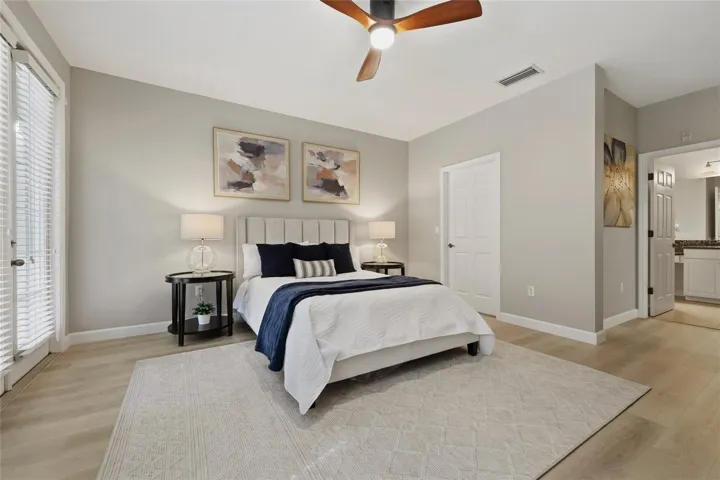Generously sized primary bedroom with plenty of room for additional furnishings and an adjoining en-suite bath.