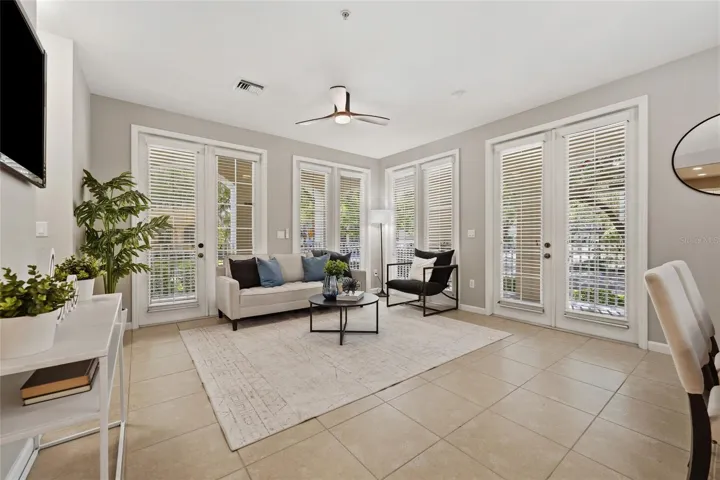 Corner-unit design provides exceptional natural light with multiple sets of French doors opening to the covered outdoor living areas.