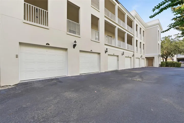 Rear view of the residence and private garage access.