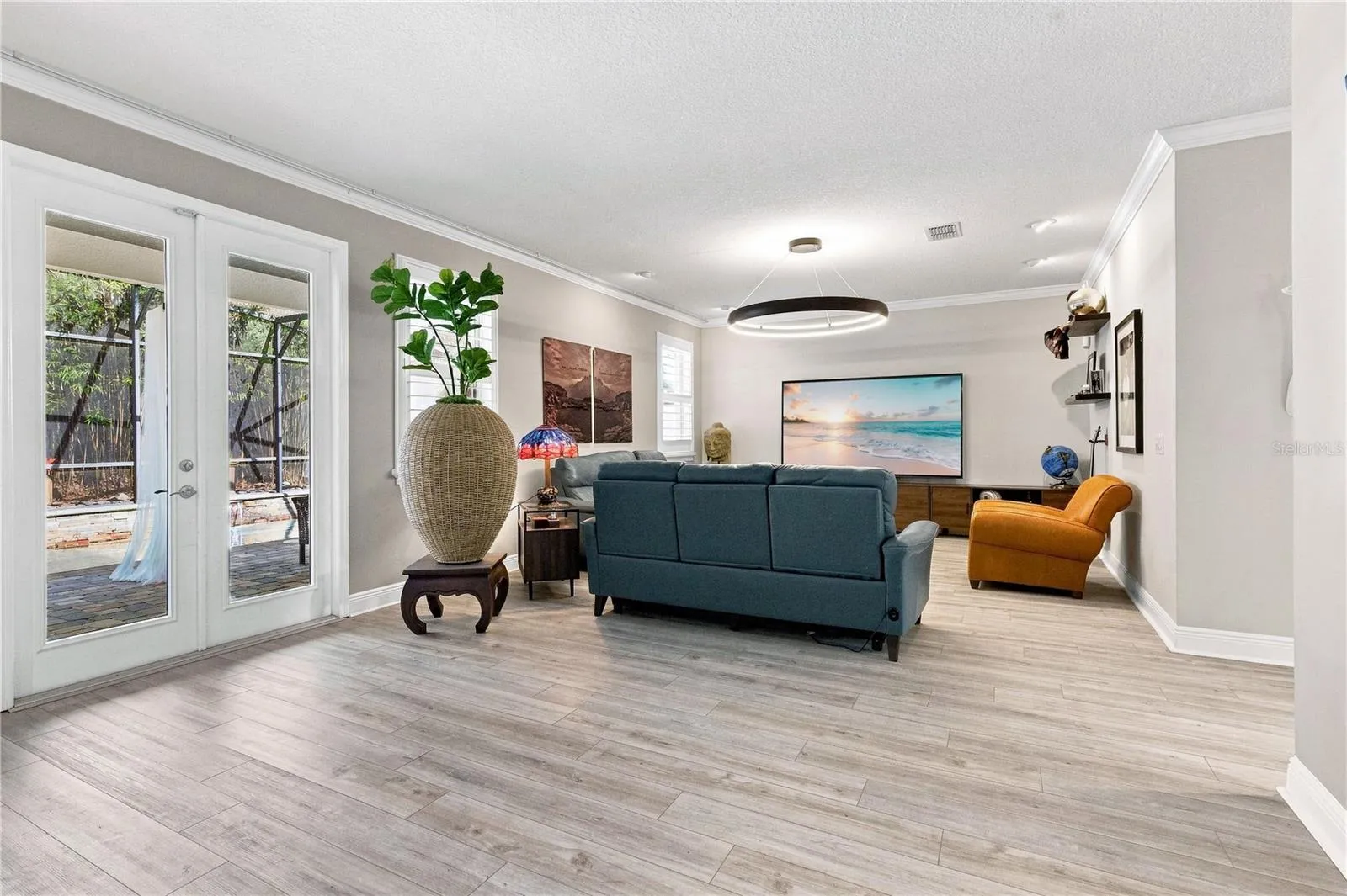 Family room with french doors to the outdoor retreat.