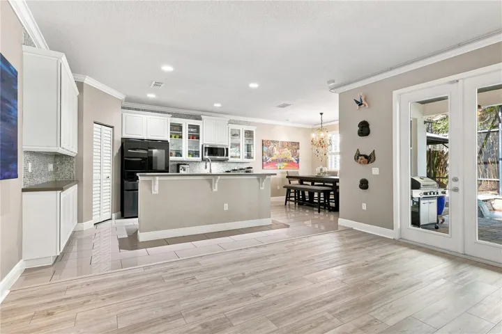 Kitchen, Dining Room, &amp; French Patio Door view from Family Room