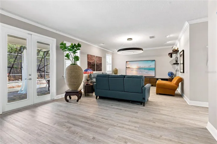Family room with french doors to the outdoor retreat.