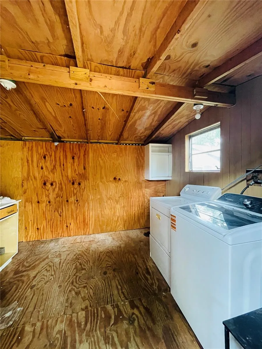 Outdoor shed with washer and dryer.