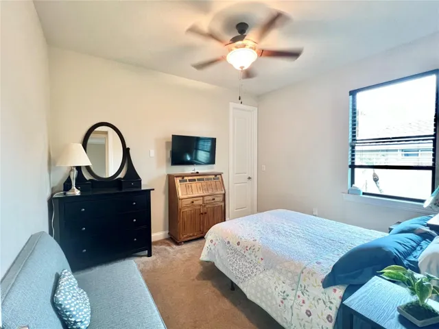 Bedroom with walk-in closet