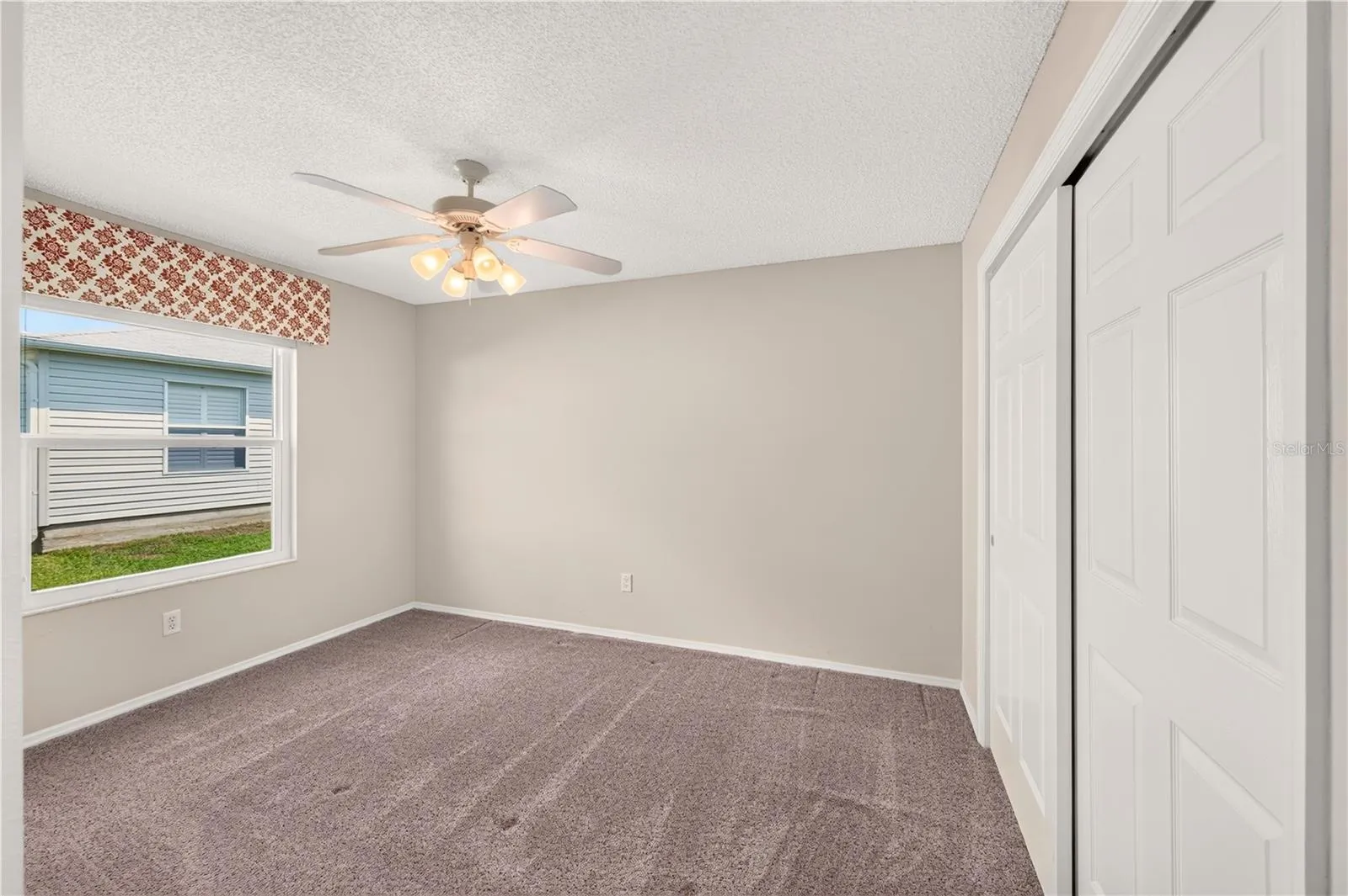 The guest bedroom has a large closet.