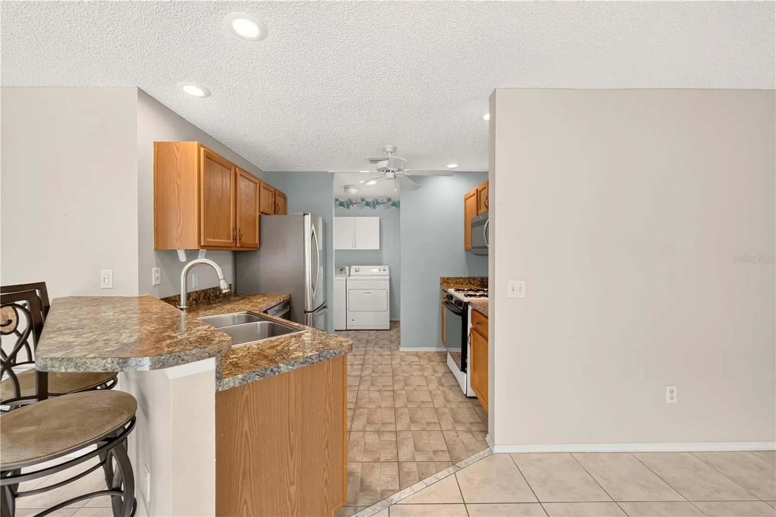 A glance through the kitchen into the laundry room.