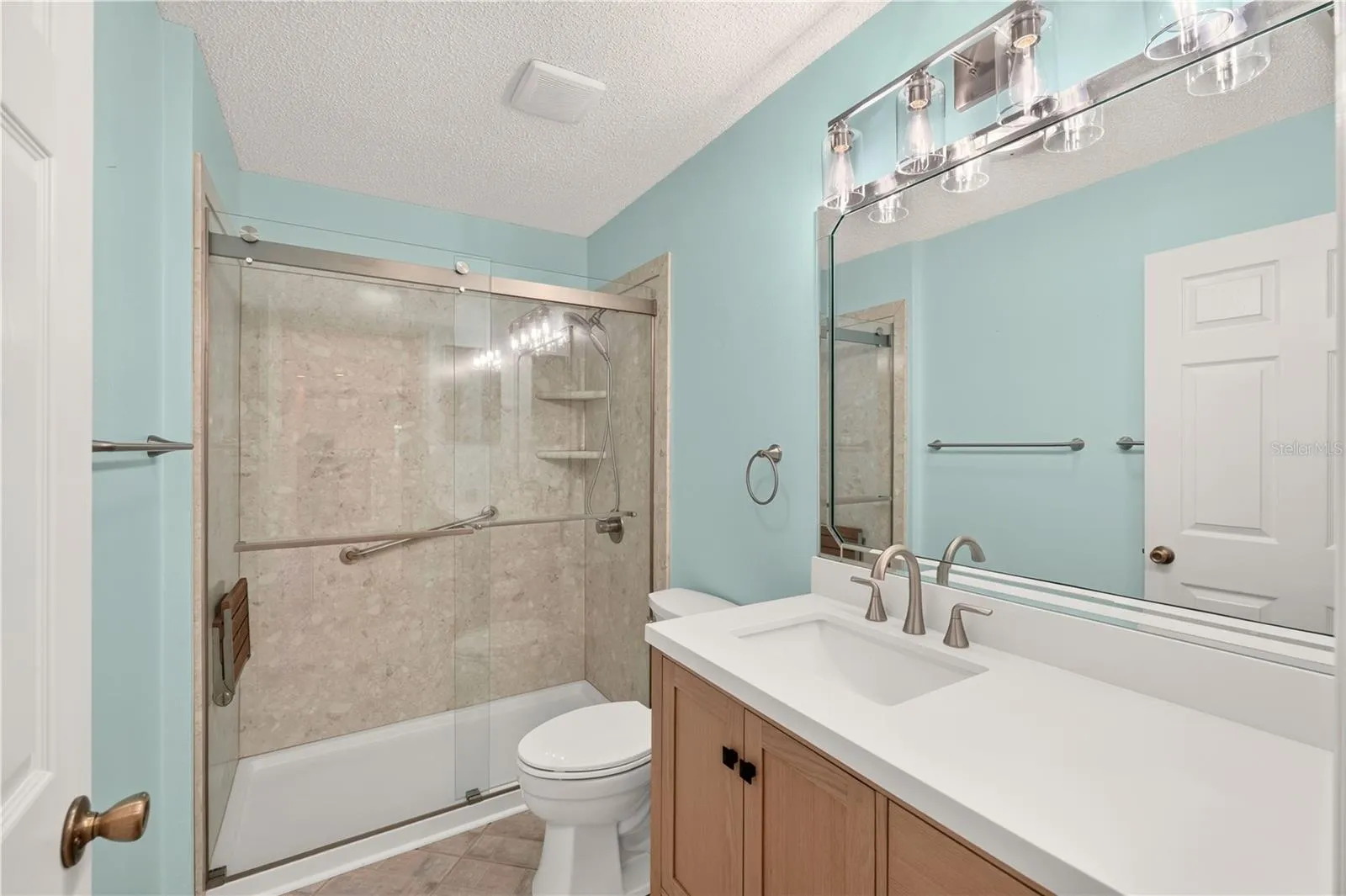 The tub/shower combo has been replaced with a walk in shower in the guest bathroom.