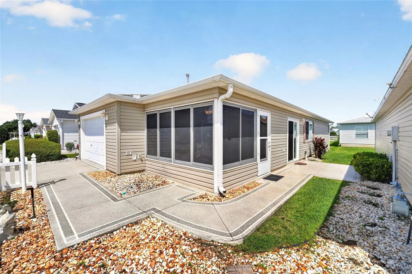 8214 SE 169th Palownia Loop.  You will appreciate the beautifully painted drive and sidewalks and patio.