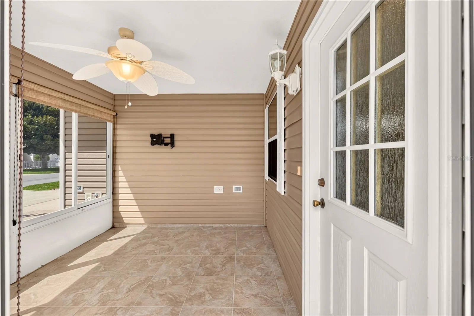 Welcome to the front lanai.  The side door allows for a sleeker look to the front of the house.
