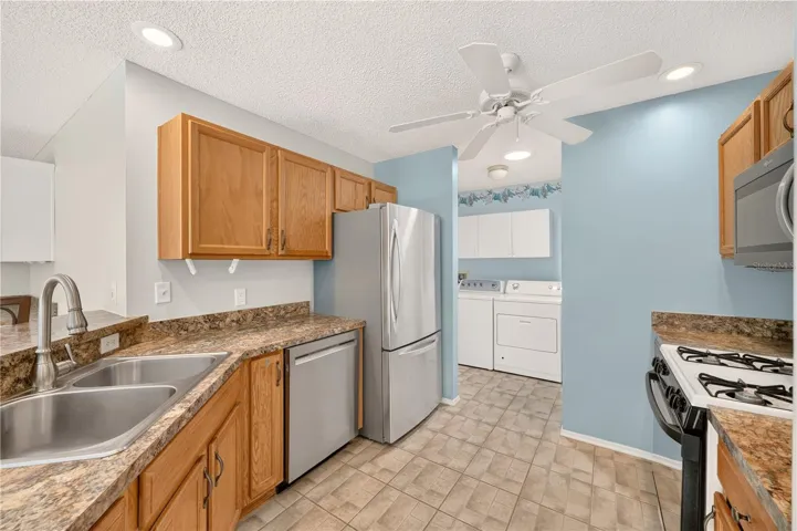 Going through the kitchen into the laundry room will lead to the garage.