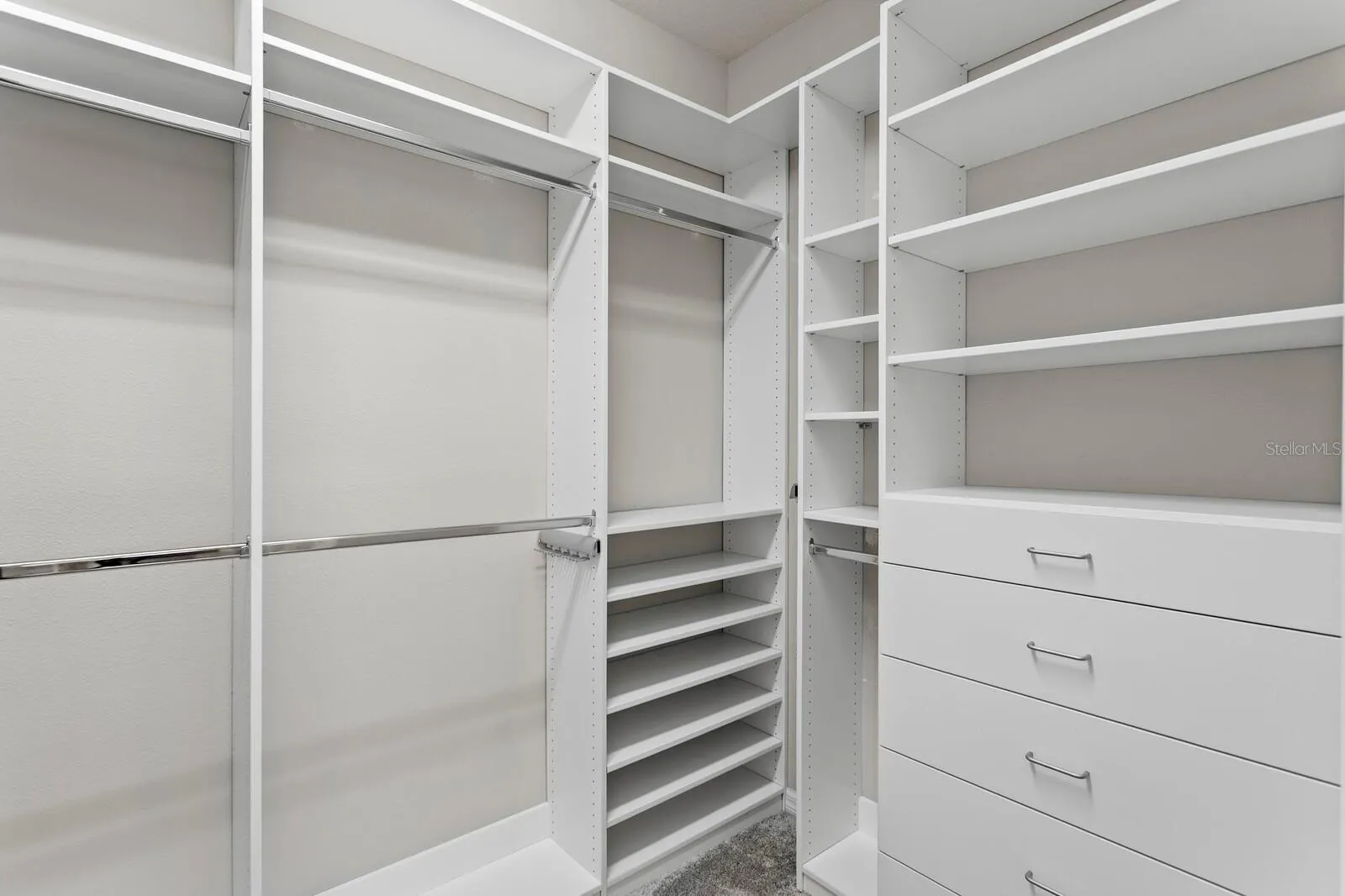 Custom organizer in large walk-in-close in primary suite