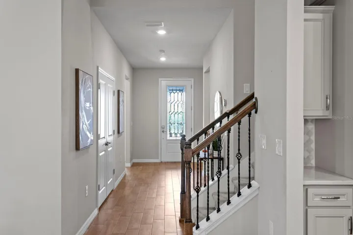 Back down foyer to front bedroom