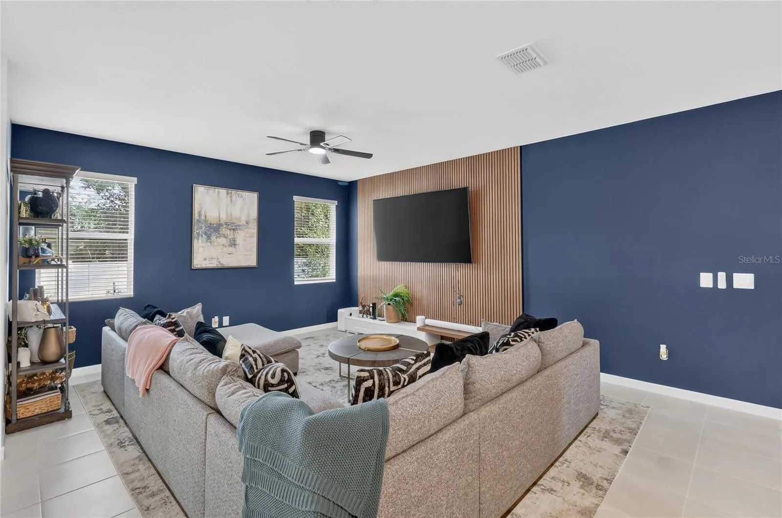 Living room with accent wall and updated tv mount.